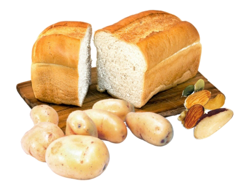 A chopping board with bread, potatoes and nuts