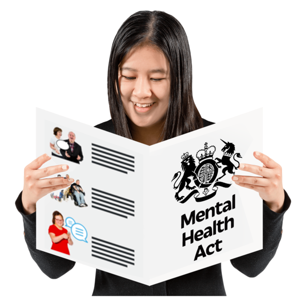 A person reading an easy read mental health act leaflet