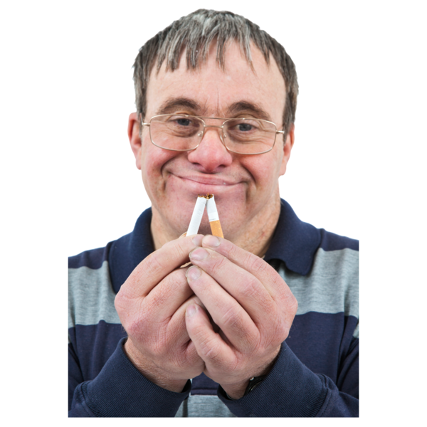 A man smiling and holding two broken cigarettes.
