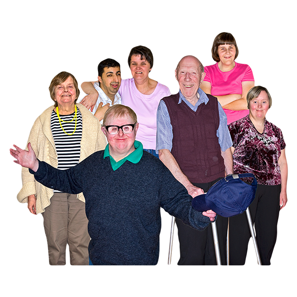 A group of seven diverse individuals posing together with happy expressions.