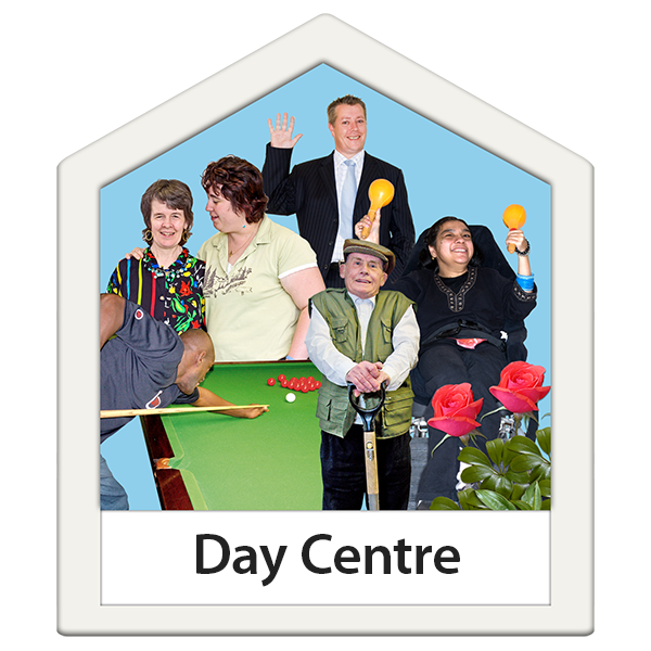 People engaging in activities at a day centre, including playing pool and interacting with each other.