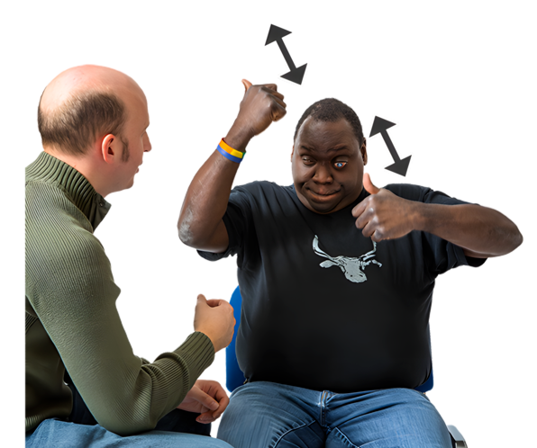 A man in a wheelchair signing to another man