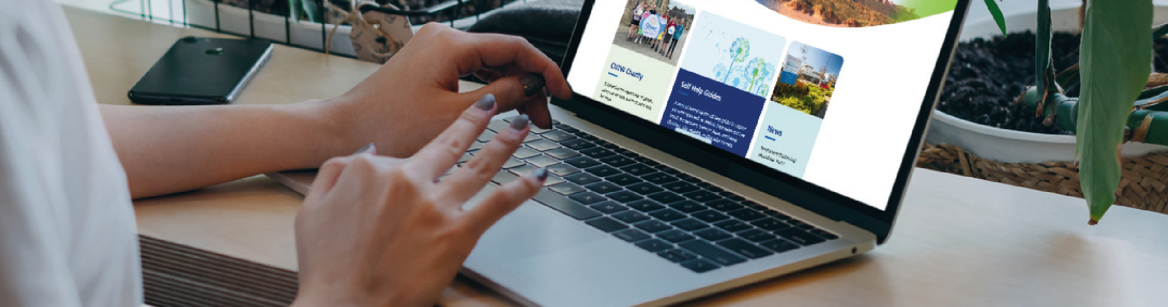 Image of a person using a laptop to look at the new CNTW website