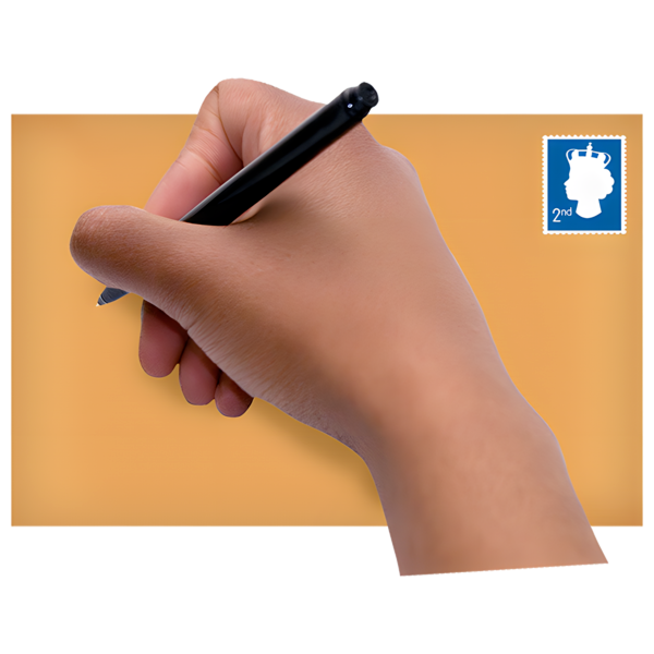 A person writing on a brown envelope