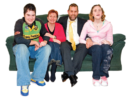 Family sitting together on a sofa