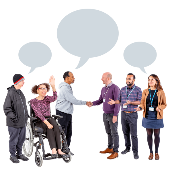 A group of people talking and shaking hands