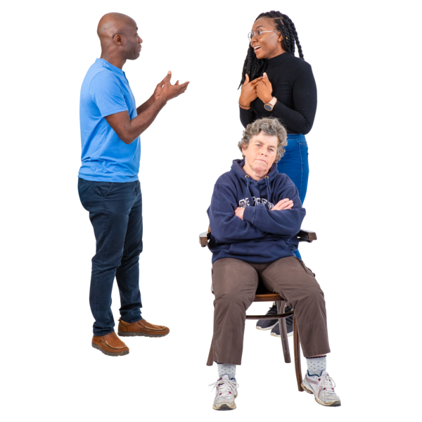 Three people interacting, with one woman sitting on a chair and two people standing and talking.