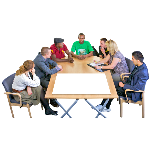 A group of people are talking around a large table