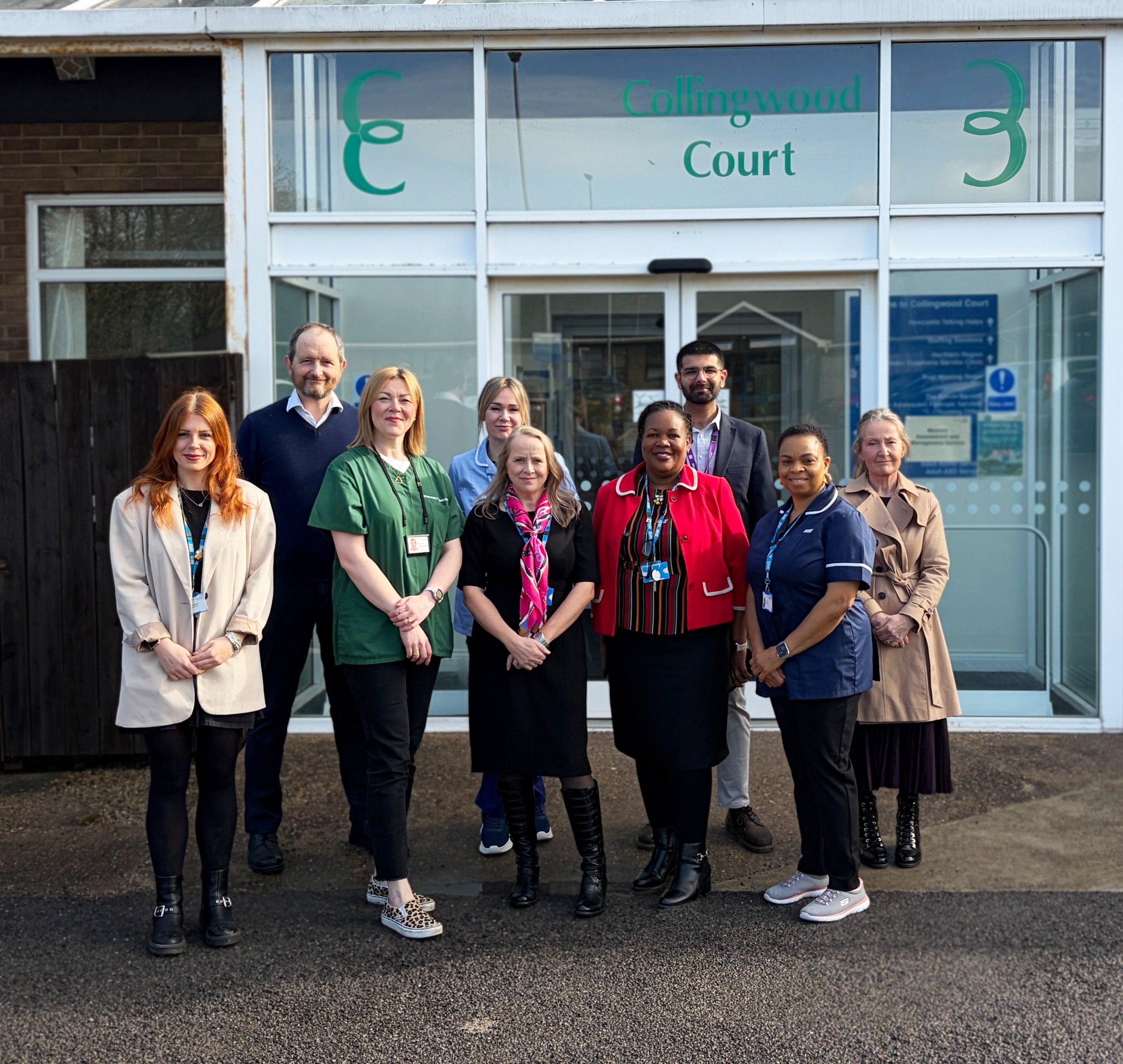 Preccis team standing together outside of their clinic