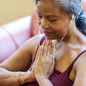 Senior Woman meditating at home