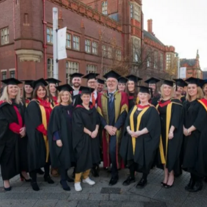 Group of Northumbria students pose together in their graduation gowns