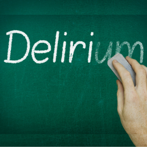 Hand erasing the word DELIRIUM written on blackboard