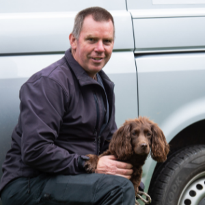 Dog Handler John Ashworth with Coco, Cocker Spaniel, in the grounds of St Nicholas Hospital