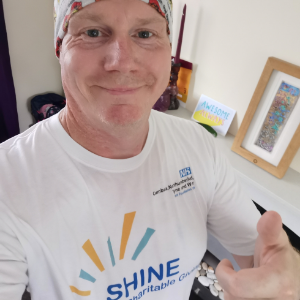 Paul Sams in his Shine Fund tshirt