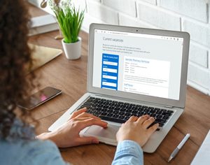 woman looking at vacancies on a laptop