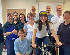 Team of staff with a bicycle