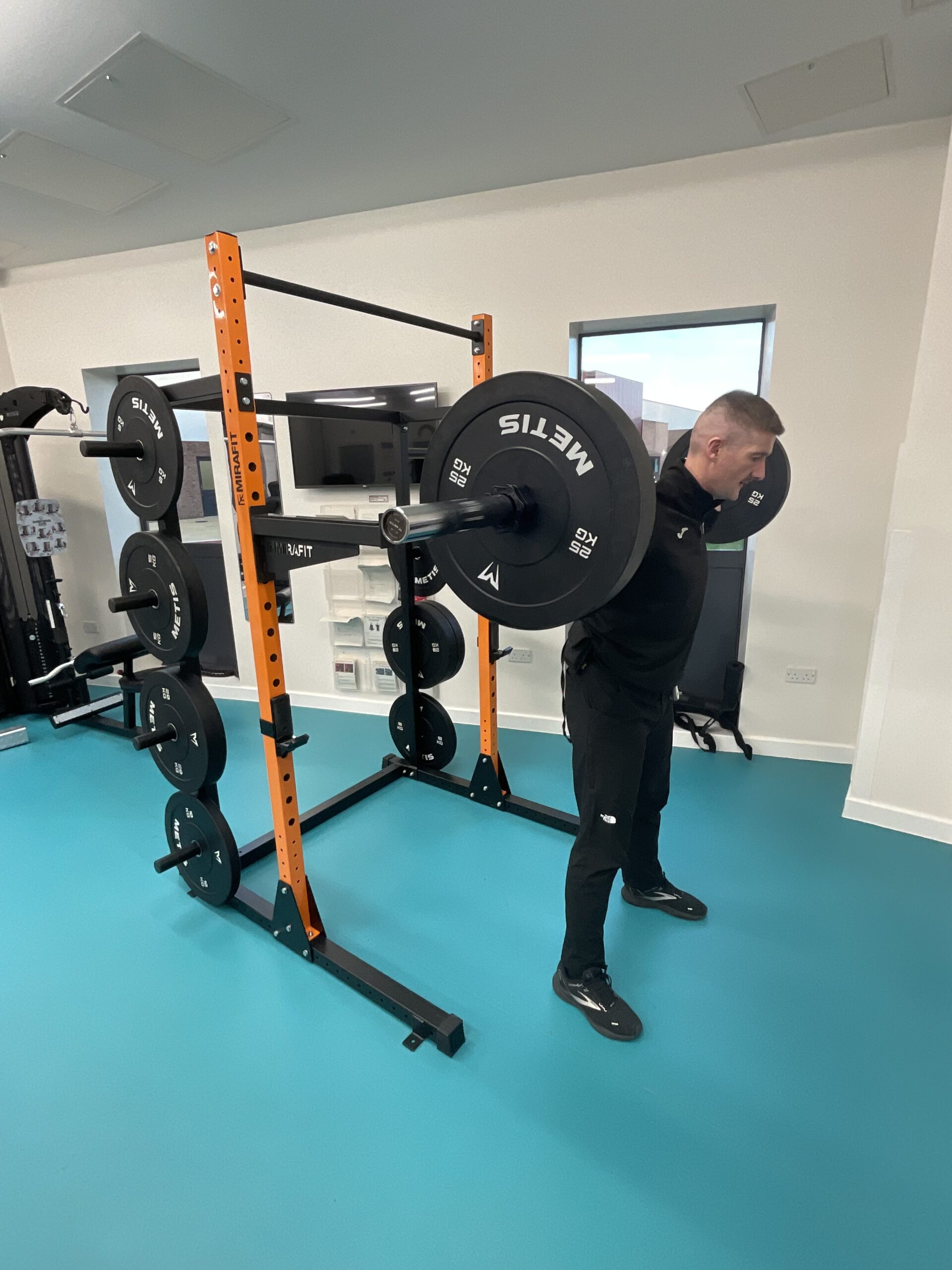 Member of staff using weights