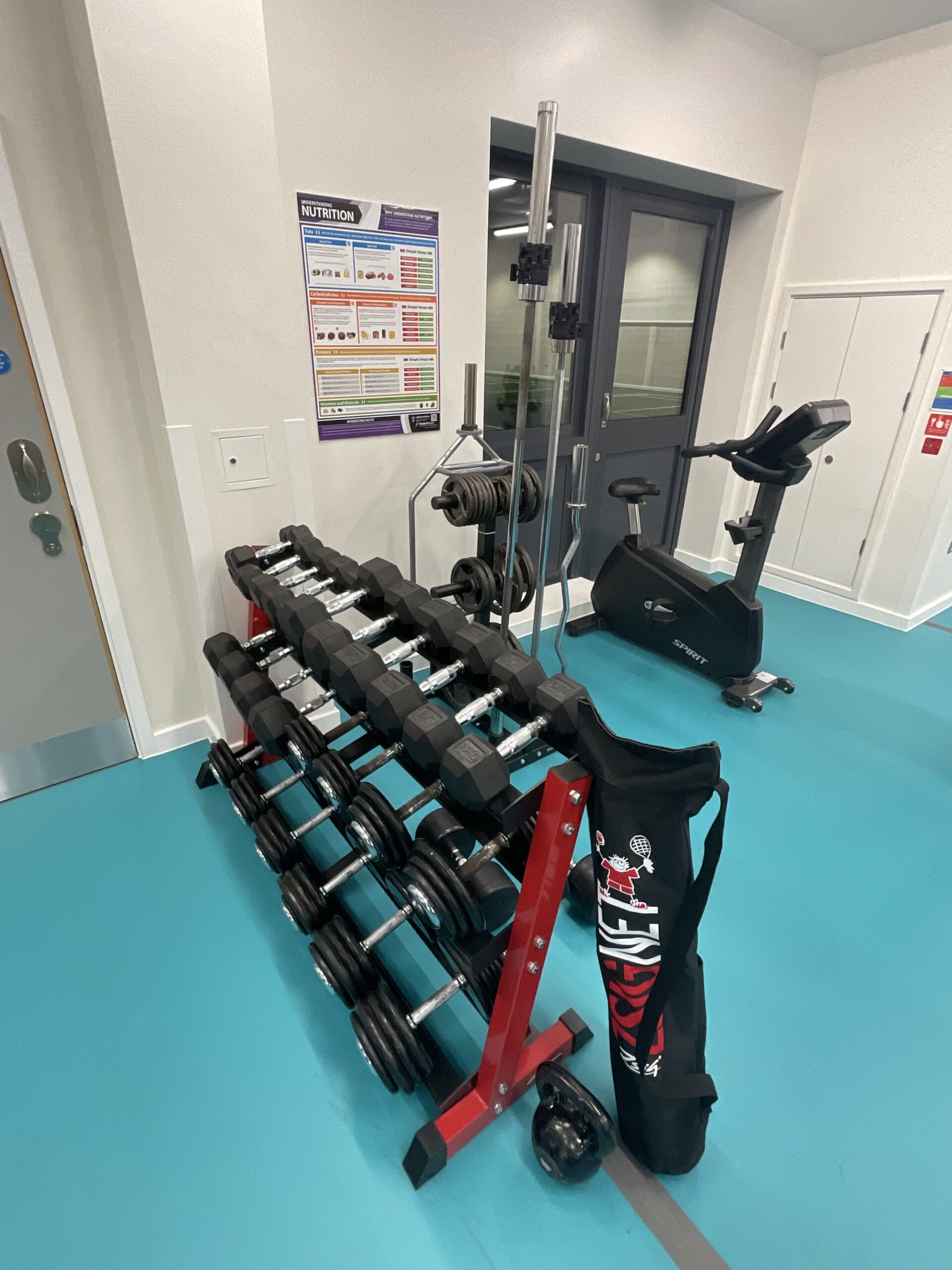 Large set of dumbbells on a rack