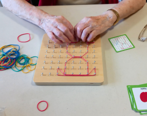 Close up of hands using sensory game